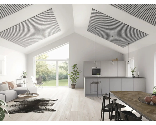 Salon lumineux avec cuisine ouverte, panneaux acoustiques au plafond, canapé et table à manger