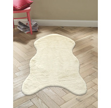 Tapis décoratif en peau de mouton clair sur parquet