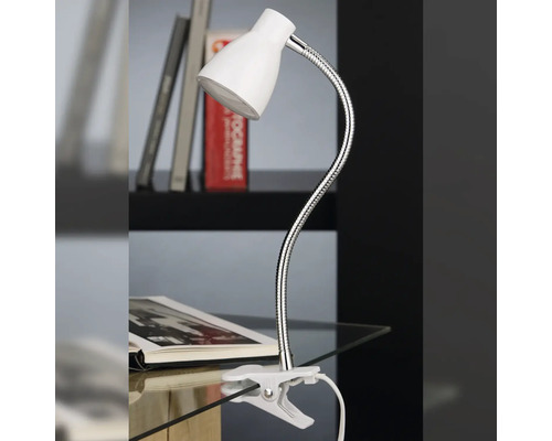 Lampe de bureau avec pince et bras flexible sur une table avec livre