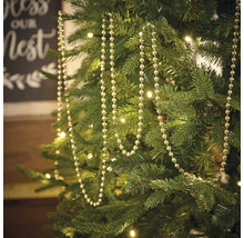 Sapin de Noël décoré d''une guirlande de perles argentées