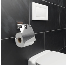 Porte-papier hygiénique en métal avec chasse d''eau sur un mur carrelé