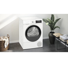 Sèche-linge blanc Siemens dans une buanderie