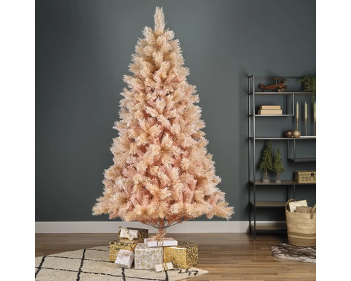 Sapin de Noël artificiel décoré avec des cadeaux dans le salon