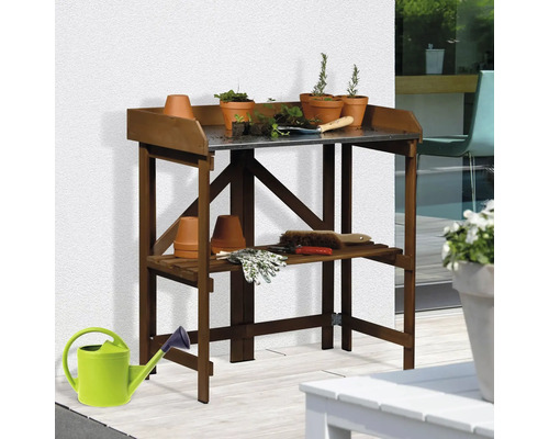Table de rempotage en bois avec plaque métallique et accessoires de jardinage