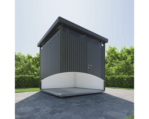 Abri de jardin moderne avec toit plat et fondations partielles sur terrasse en pierre