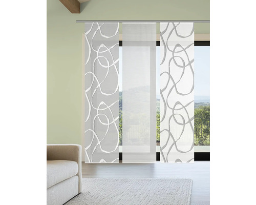 Panneaux japonais avec motif abstrait devant une fenêtre