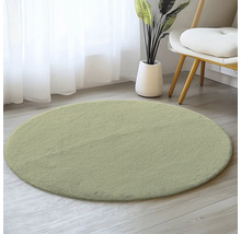 Tapis rond en matériau souple sur plancher en bois