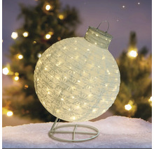Dekorative, beleuchtete Weihnachtskugel mit Schneeflockenmuster auf einem Ständer