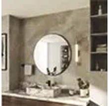 Salle de bains avec miroir rond, lavabo et étagère