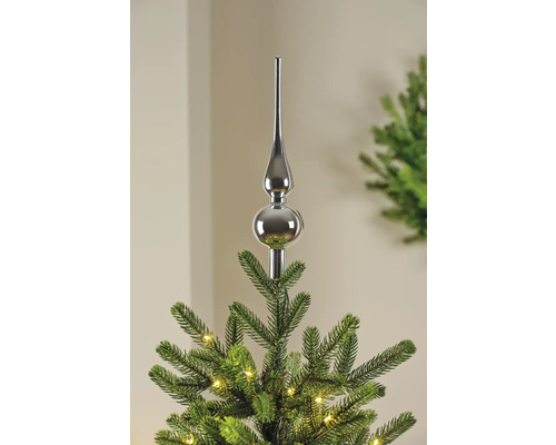 Weihnachtsbaumspitze aus Metall auf einem Weihnachtsbaum