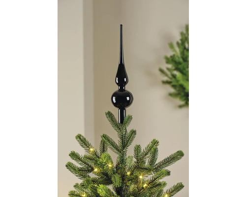 Schwarze Christbaumspitze auf einem Weihnachtsbaum