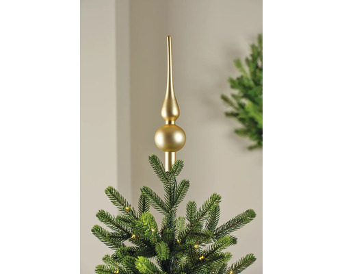 Goldener Baumspitzenaufsatz auf einem Weihnachtsbaum