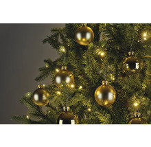 Gros plan d'un arbre de Noël avec des boules dorées et des lumières
