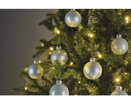 Sapin de Noël avec boules de Noël et guirlande lumineuse