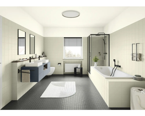 Salle de bains lumineuse avec double vasque, baignoire et cabine de douche