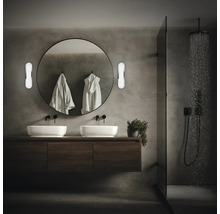 Modernes Badezimmer mit Doppelwaschtisch, rundem Spiegel und Dusche