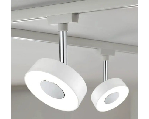 Deux spots LED ronds et blancs sont fixés sur un rail
