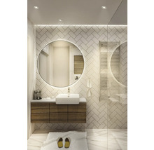 Helles Badezimmer mit Waschtisch, rundem Spiegel und Handtuchwärmer