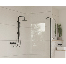 Salle de bains moderne avec ensemble de douche noir, paroi de douche et miroir ovale