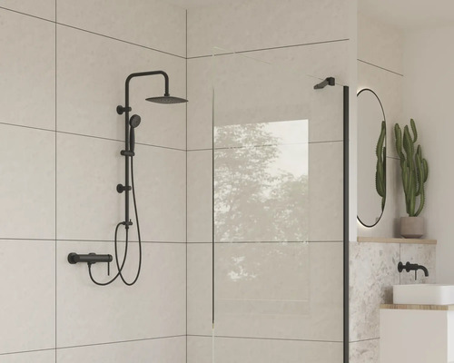 Salle de bains moderne avec ensemble de douche noir, paroi de douche et miroir ovale