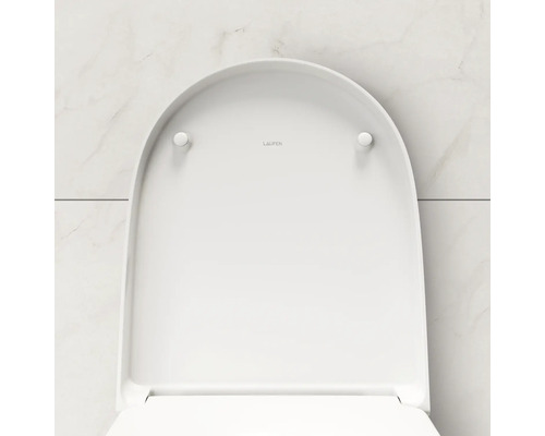 Logo Laufen sur un siège de toilette