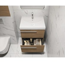Meuble sous-lavabo avec tiroir ouvert et lavabo dans une salle de bain