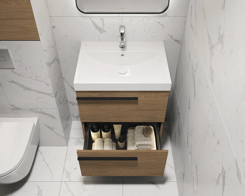Meuble sous-lavabo avec tiroir ouvert, lavabo et robinet dans une salle de bain lumineuse