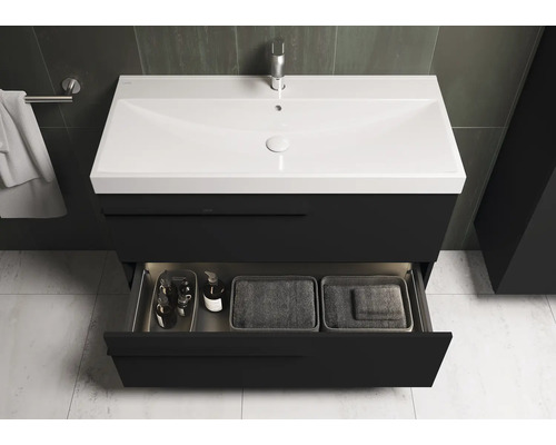 Meuble-lavabo avec tiroir ouvert, lavabo, robinet et serviette