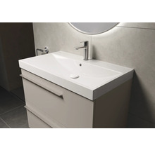 Meuble-lavabo avec armoire et robinet dans la salle de bain