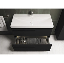 Meuble-lavabo avec tiroir ouvert dans une salle de bains