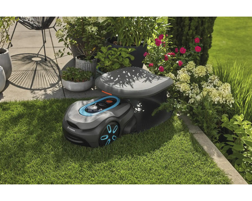 Robot tondeuse Gardena avec station de charge dans le jardin