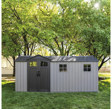 Abri de jardin en plastique avec double porte et fenêtres dans le jardin