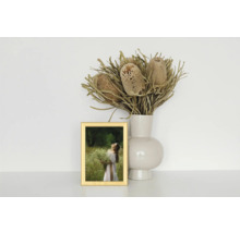 Nature morte décorative avec cadre photo, vase à fleurs et fleurs séchées