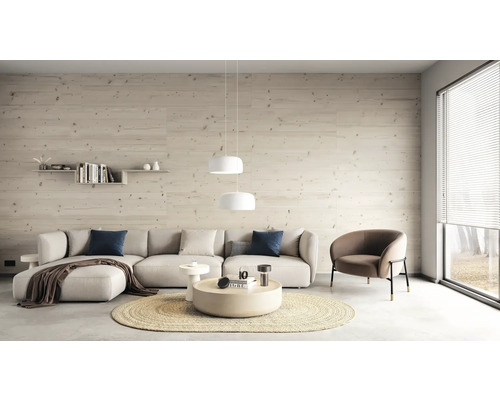 Salon avec canapé d'angle, fauteuil, table basse, suspensions rondes, étagère murale et panneaux de bois