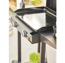 Vue détaillée d'un gril avec boutons de commande et espace de rangement