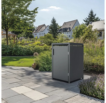 Box poubelle dans jardin sur dalles de pierre