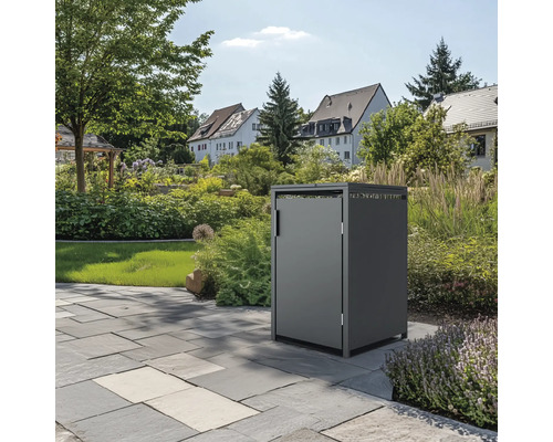 Box poubelle dans jardin sur dalles de pierre