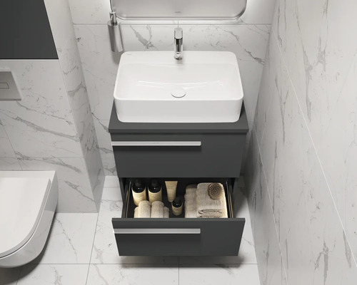Salle de bains moderne avec meuble sous-lavabo, vasque à poser et tiroir ouvert