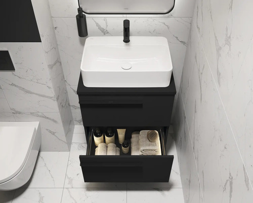 Salle de bains moderne avec meuble-lavabo noir, vasque à poser blanche et tiroir ouvert