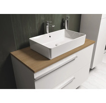 Vasque à poser rectangulaire sur un meuble-lavabo avec tiroirs dans la salle de bain