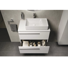 Meuble-lavabo avec tiroir ouvert et vasque à poser dans la salle de bains