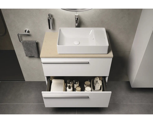 Salle de bain moderne avec meuble sous-lavabo blanc, tiroir ouvert et vasque à poser