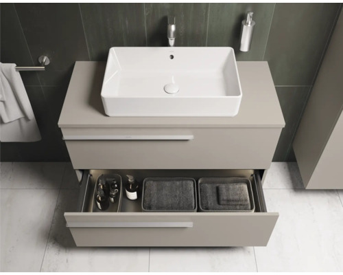 Salle de bains moderne avec lavabo et élément de tiroir ouvert