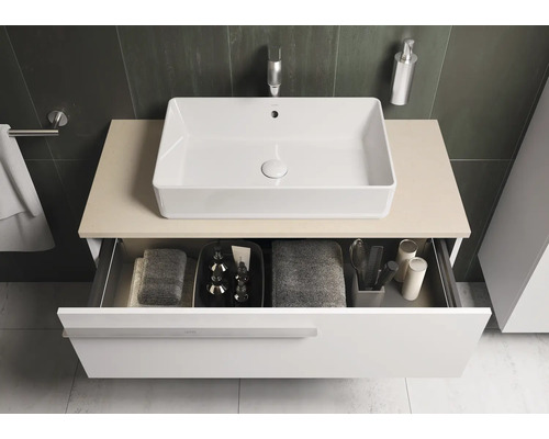 Salle de bains moderne avec lavabo à poser et élément de tiroir ouvert