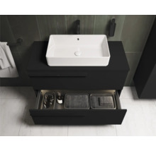 Meuble-lavabo avec vasque à poser blanche et meuble bas noir avec tiroir ouvert