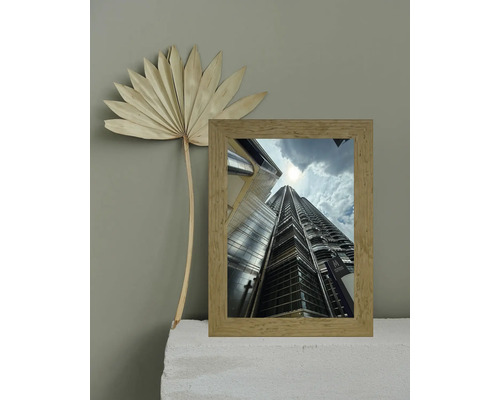 Cadre photo décoratif avec motif de gratte-ciel et fleur séchée