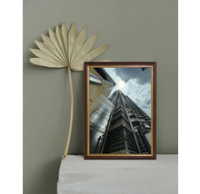 Cadre décoratif avec l'image d'un gratte-ciel et d'un palmier séché