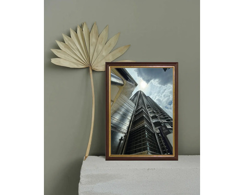 Cadre décoratif avec l'image d'un gratte-ciel et d'un palmier séché