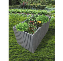 Jardinière surélevée en bois avec plantations dans le jardin