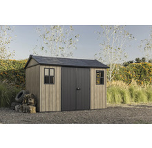 Abri de jardin avec double porte et fenêtres dans le jardin